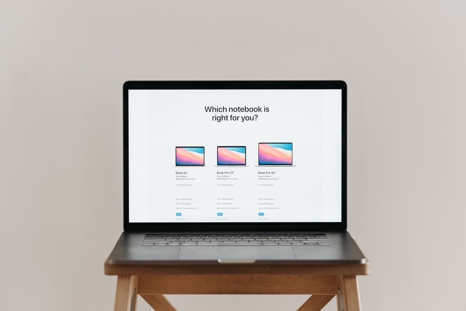 Close-up of a laptop screen showing a price comparison website with different offers for a product.