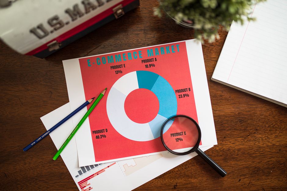 A magnifying glass hovering over a detailed online product description on a screen.