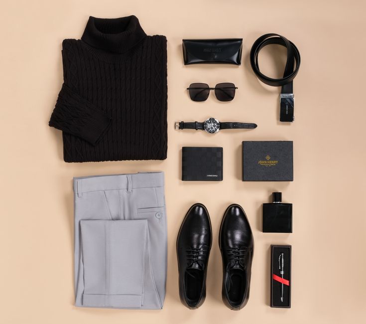 A well-organized flat lay of a men's summer capsule wardrobe, featuring linen shirts, tailored shorts, and light chinos in neutral tones, ideal for creating versatile men's summer outfits.