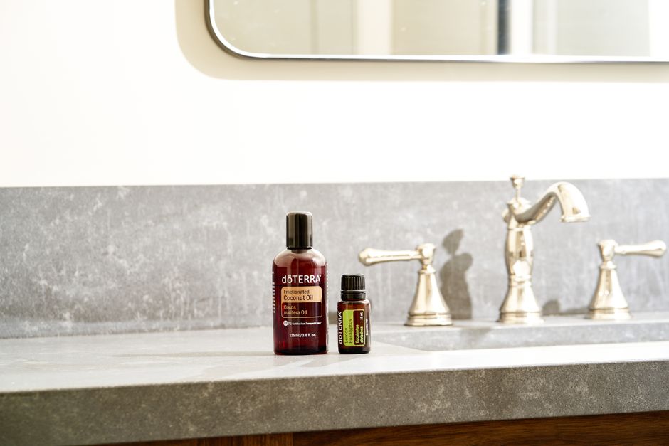 A curated selection of essential skincare products, including SPF, moisturizer, and a gentle cleanser, neatly arranged on a bathroom counter.