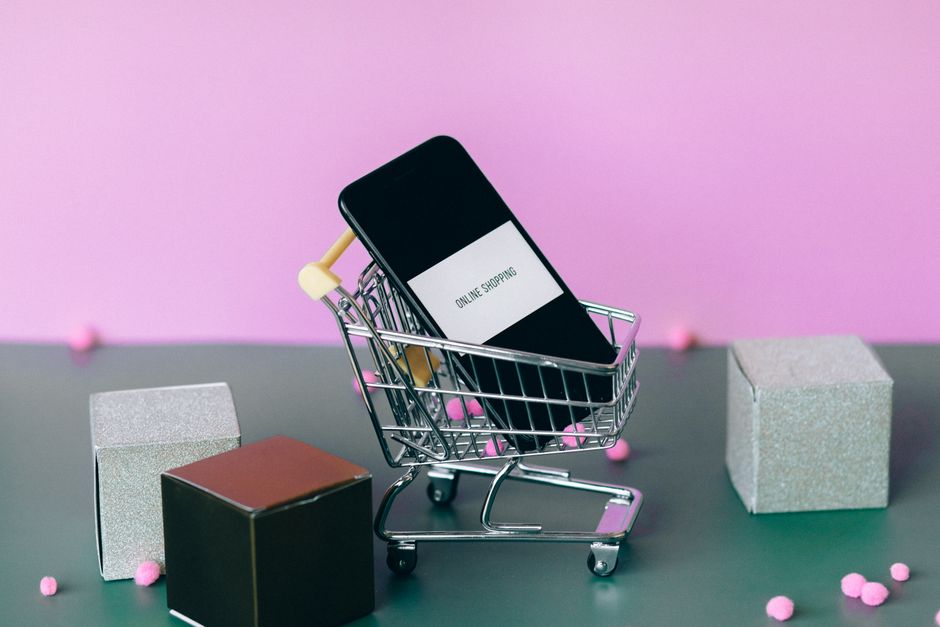 A detailed online shopping cart filled with various items, indicating a seasonal sale purchase, with discount tags visible.