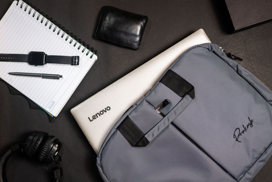 The interior of a high-quality laptop backpack, showcasing a padded compartment with a laptop and various neatly organized tech accessories.