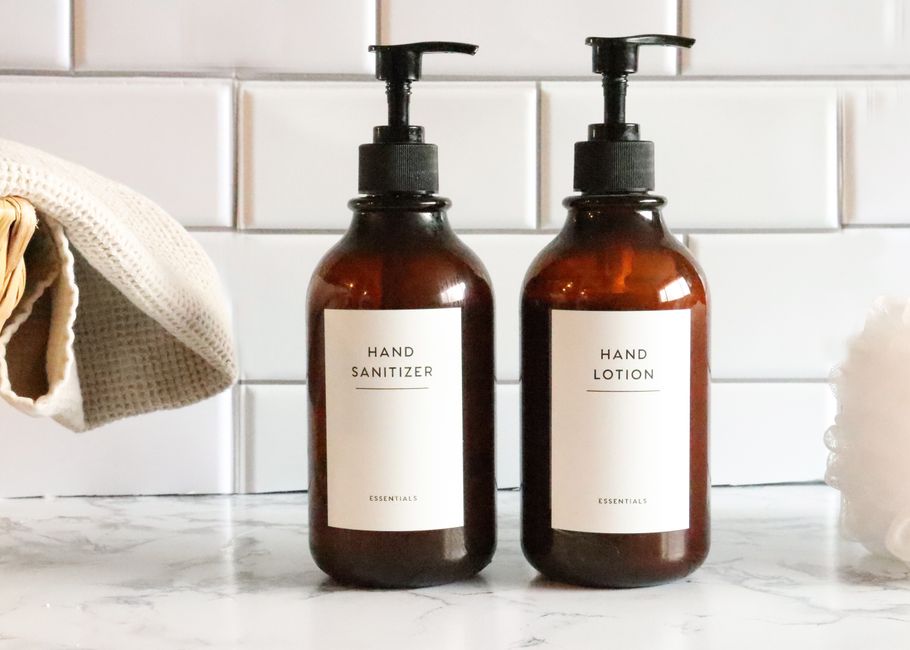 A collection of winter skincare essentials including a serum, moisturizer, and SPF bottle on a clean, light-colored surface.